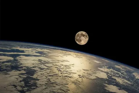 An image from space of the Earth and the Moon.