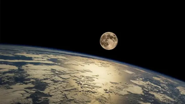 An image from space of the Earth and the Moon.