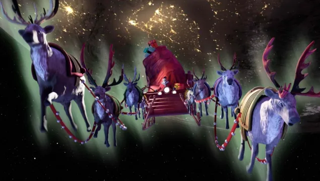 Santa's sleigh with lots of reindeer carrying it through the night sky, from show What Santa Sees.