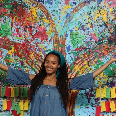 Artist Rosina Al-Shaater in front of The Soul Tree 