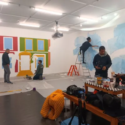 The We The Curious exhibitions team and Nature Rising team together in The Box - Street Scene mural and The Soul Tree 