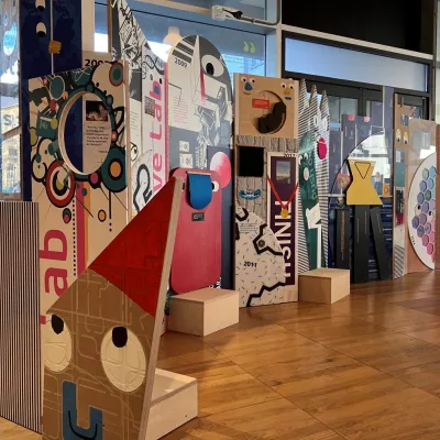 The Curious Timeline - a colourful collection of displays, pictures and painted smiley faces. Artists: Stand + Stare