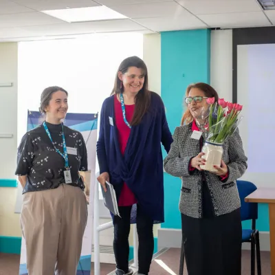 Lily's achievements are celebrated with flowers by the We The Curious team