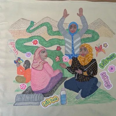 Ifrah's banner, sits alongside the poem entitled 'The Weight of Gratitude' (Artist: Sayambrita Mukherjee)