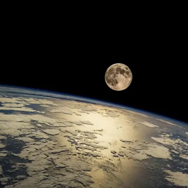 An image from space of the Earth and the Moon.