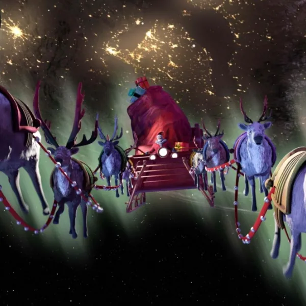 Santa's sleigh with lots of reindeer carrying it through the night sky, from show What Santa Sees.